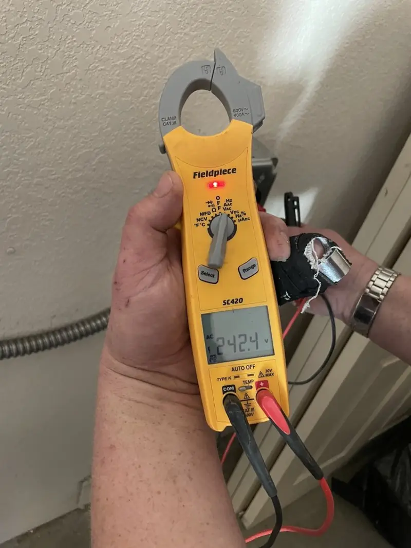 Voltage testing with clamp meter during Electrical Installation Services in Buena Vista